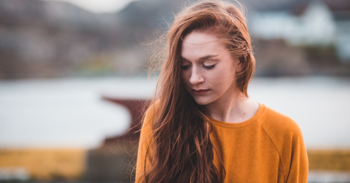 girl outside looking down