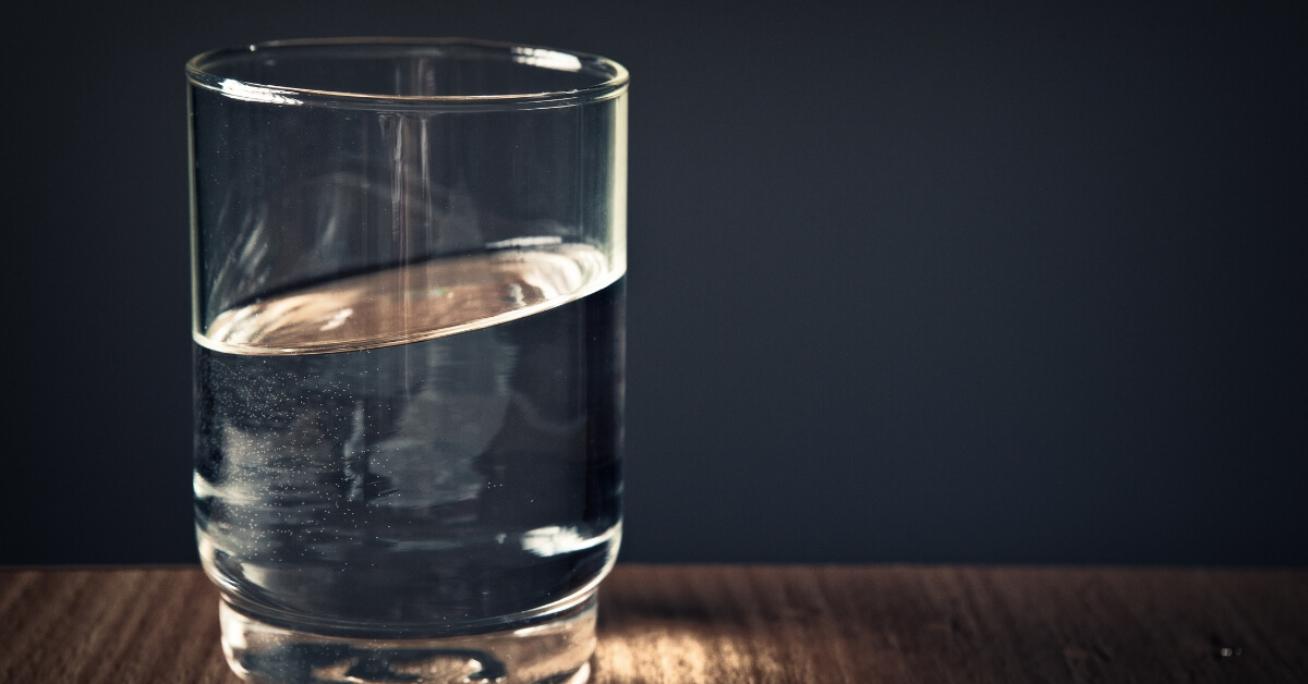 slanted water in glass cup