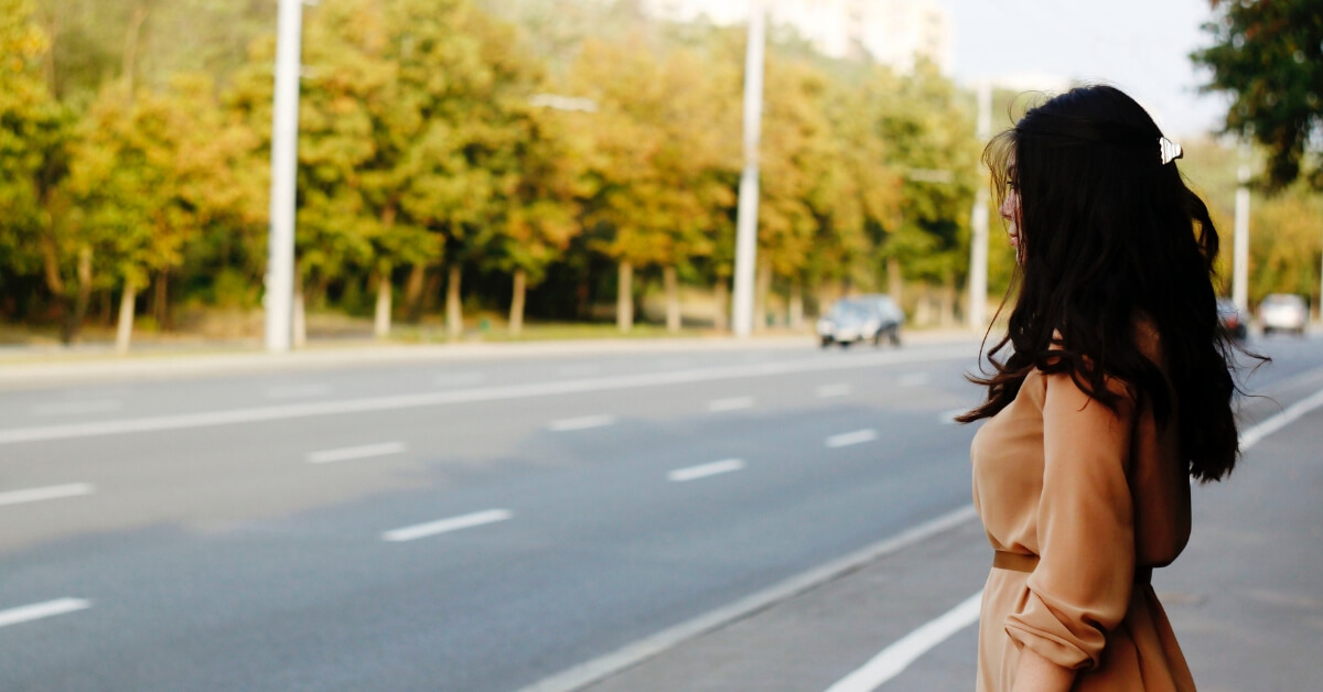 woman gazing on to street