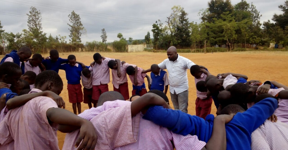 young people in foxfires youth program in a huddle