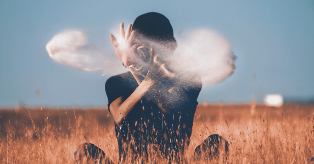 person throwing sand