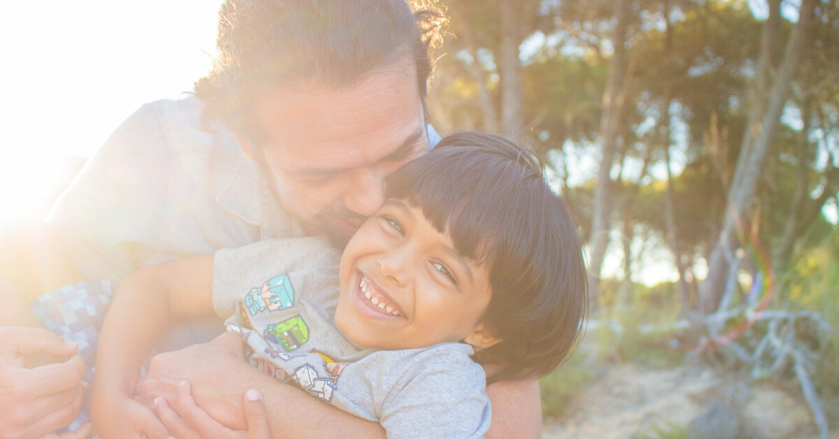 dad hugging son