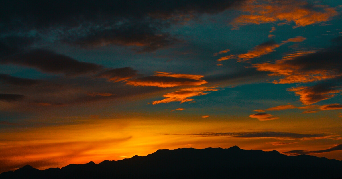 a red sky over mountains