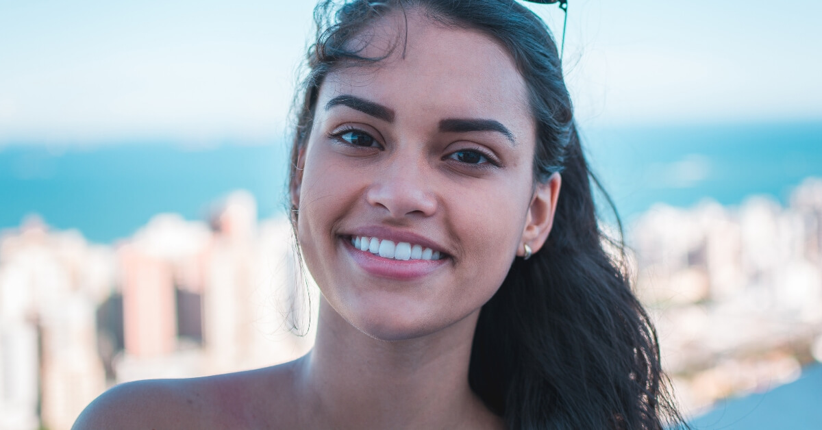 young girl smiling with windswept hair