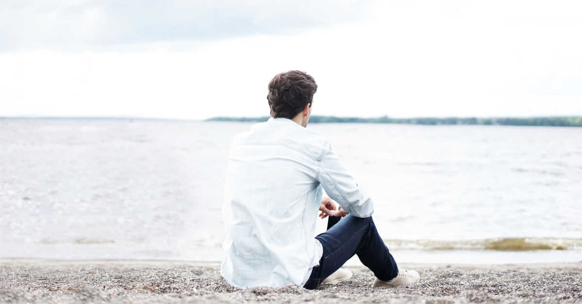 lonely man on a beach