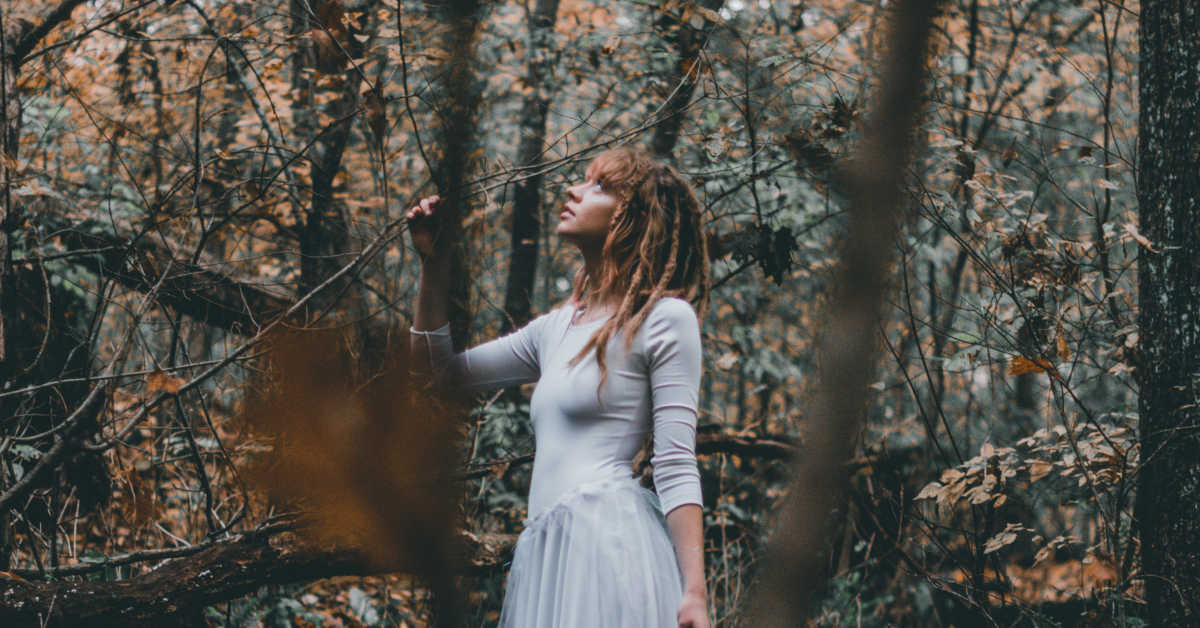 Woman in thick forrest