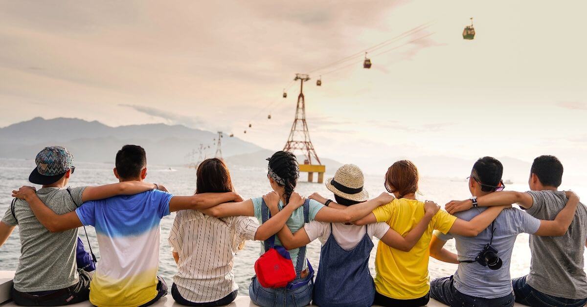 Group of friends linking arms