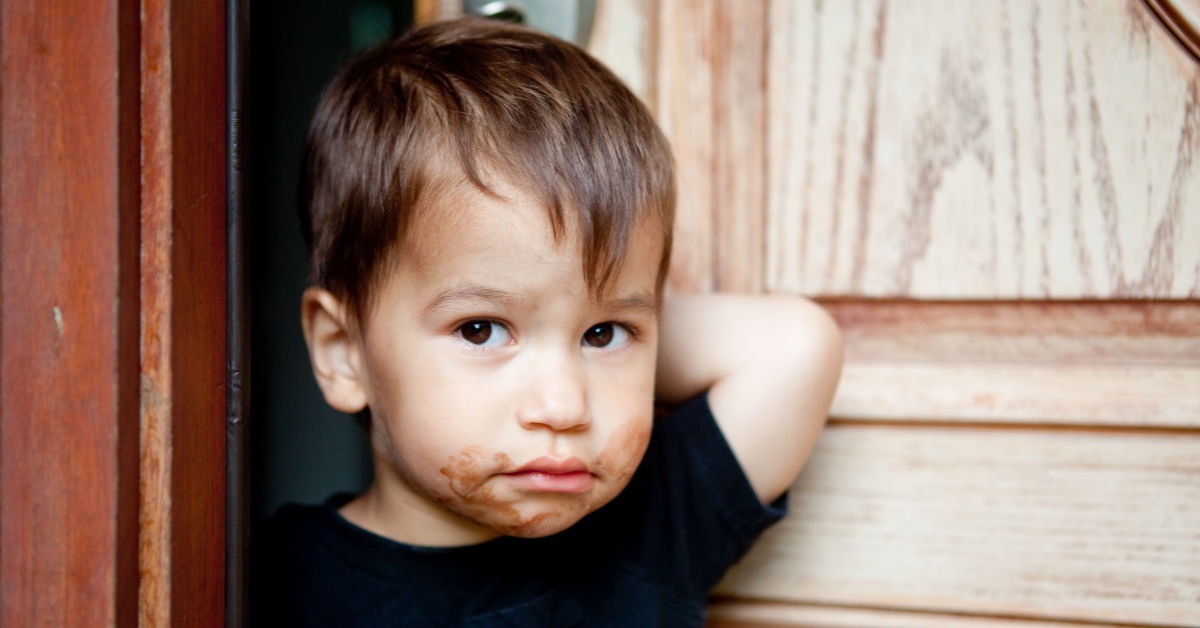 Boy with chocolate on his face