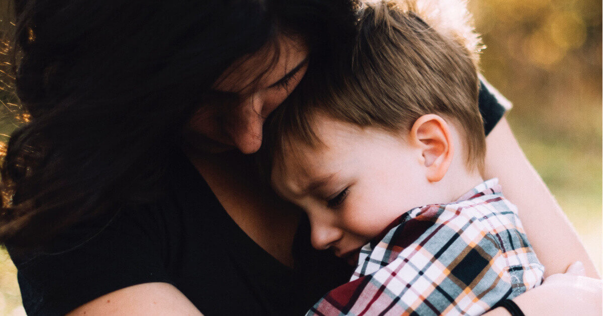 Boy and Mum hugging