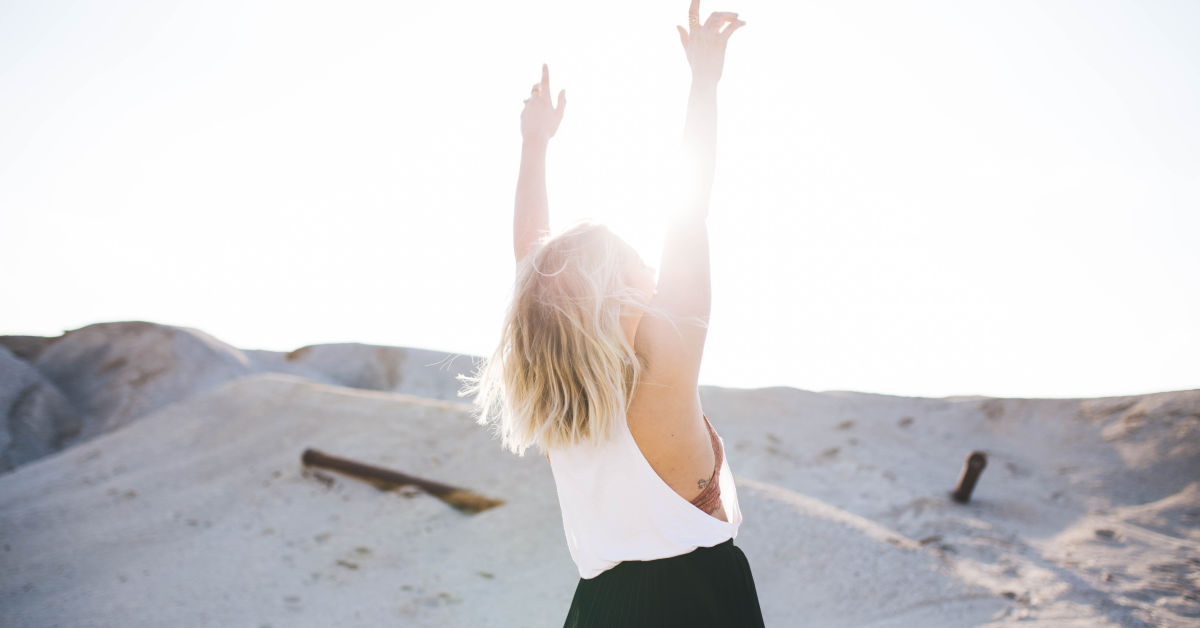 Woman with hands to the sky