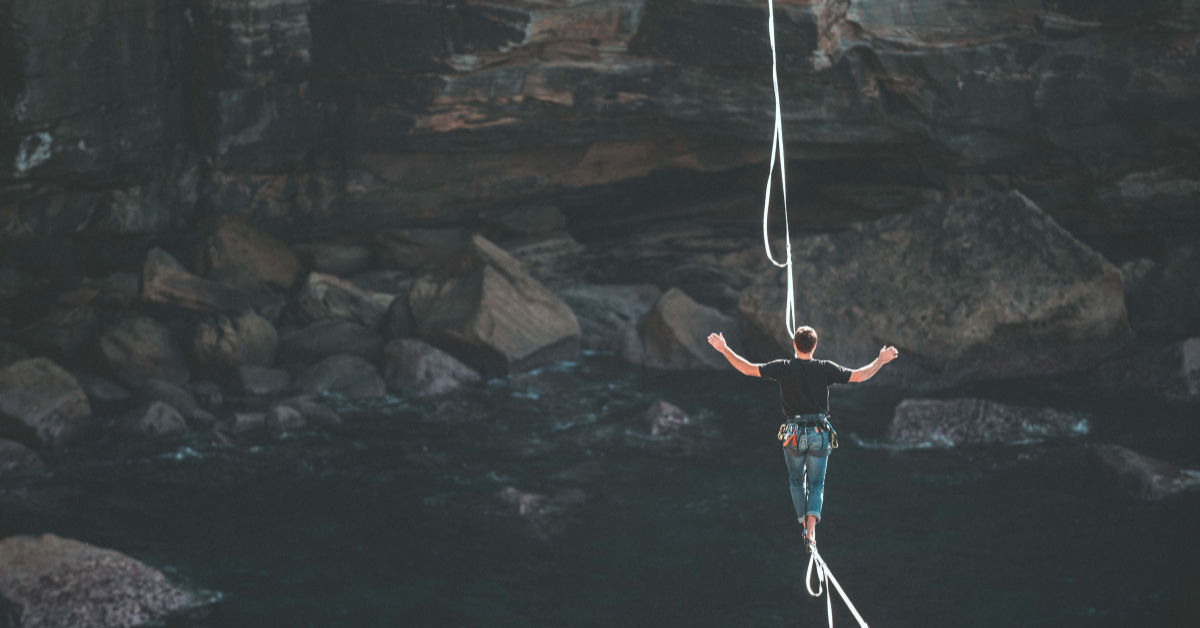 man balancing on rope