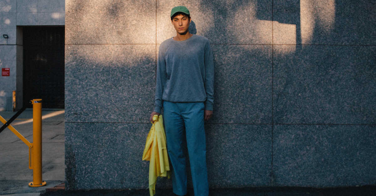 Man standing against wall