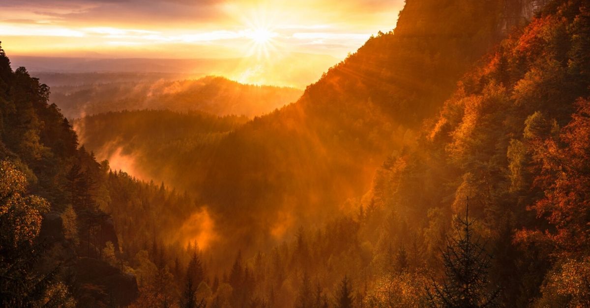 photo of a warm sunset over mountains