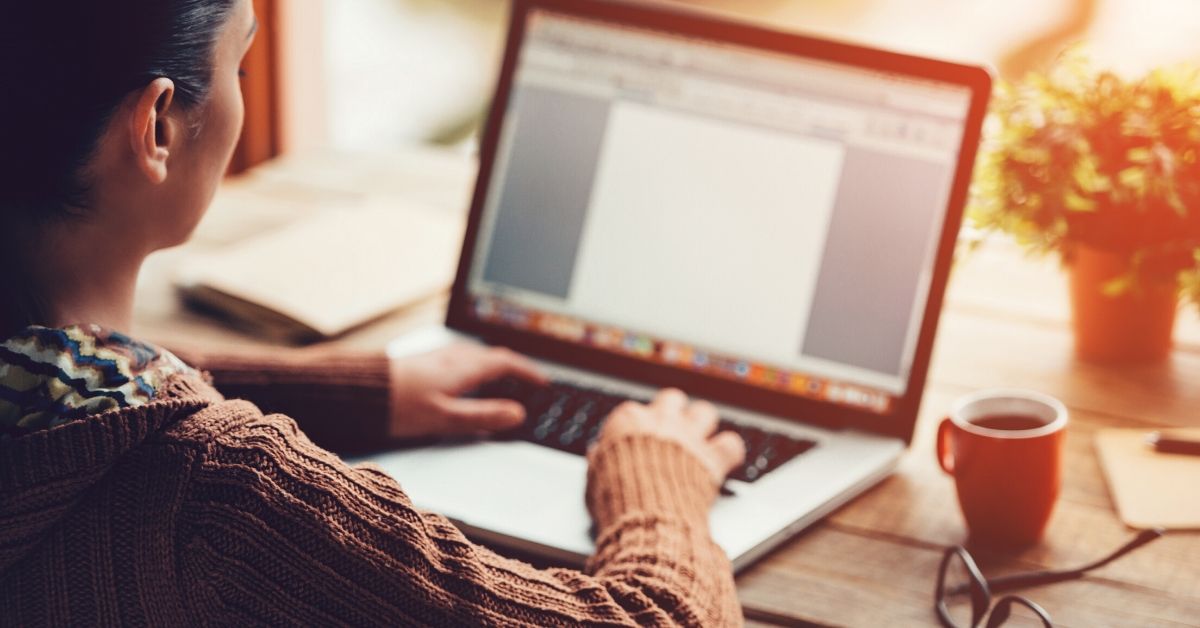 photo of a woman working on her laptop from home