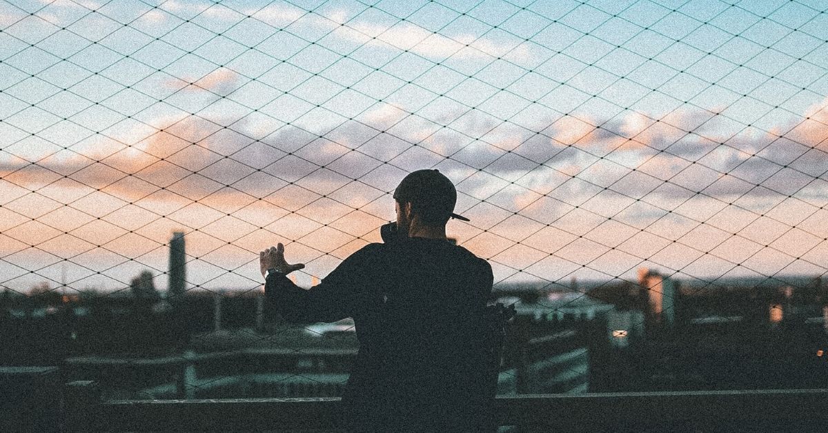 photo of a person ovrelooking a cityscape at dusk