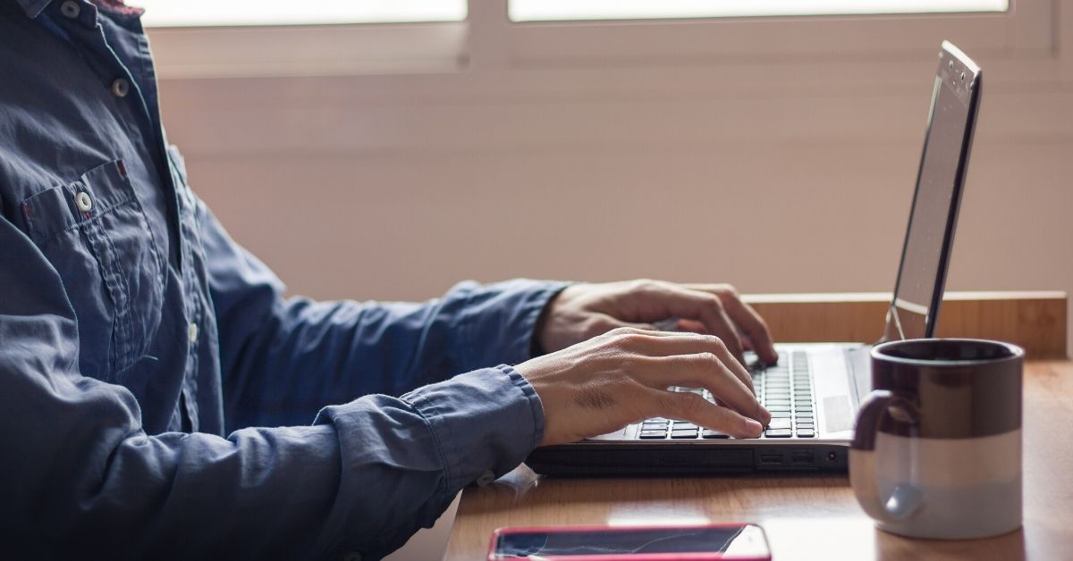 man working on laptop from home making him eligible for a tax claim