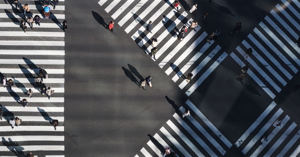 aerial photo of road crossing with many people