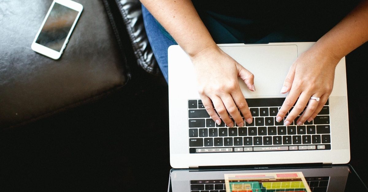 person typing on laptop