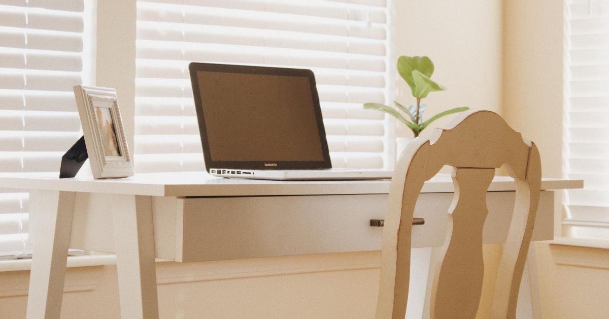 home office setup in a room with natural light pouring in