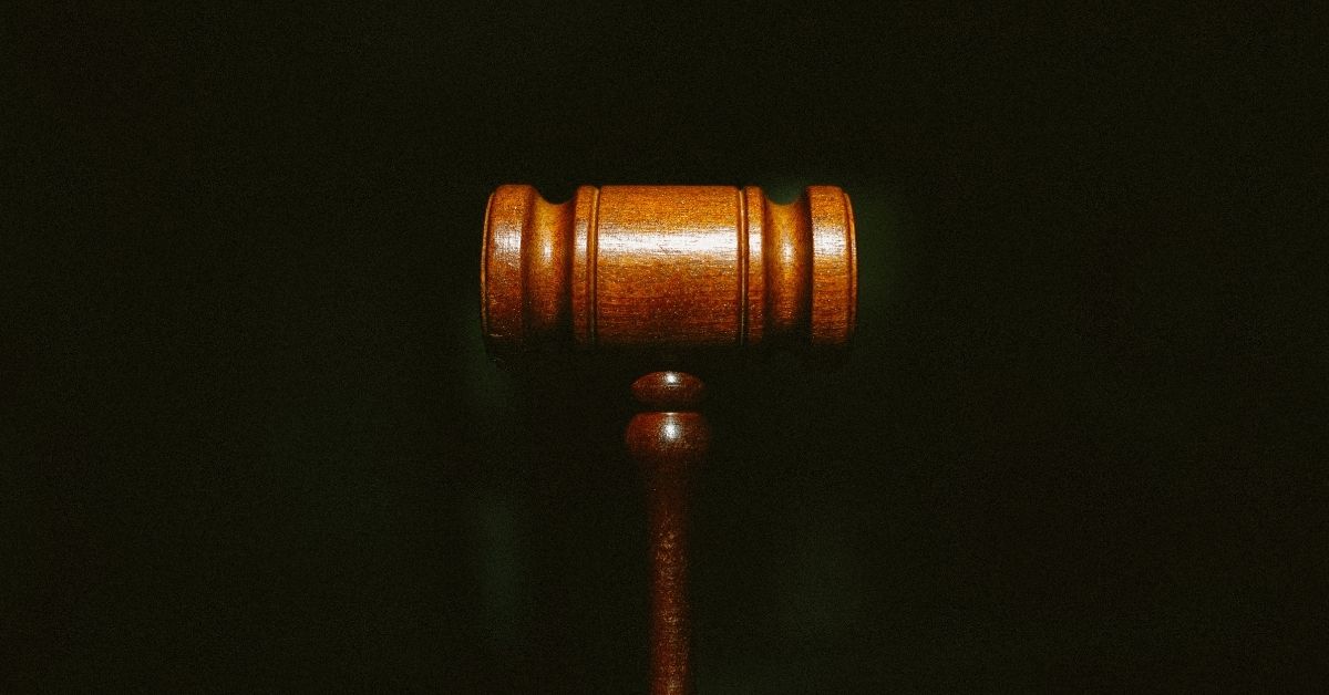 wooden gavel on black backdrop