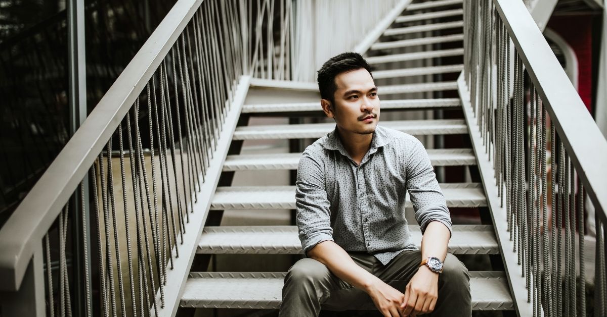 man sitting on stairs