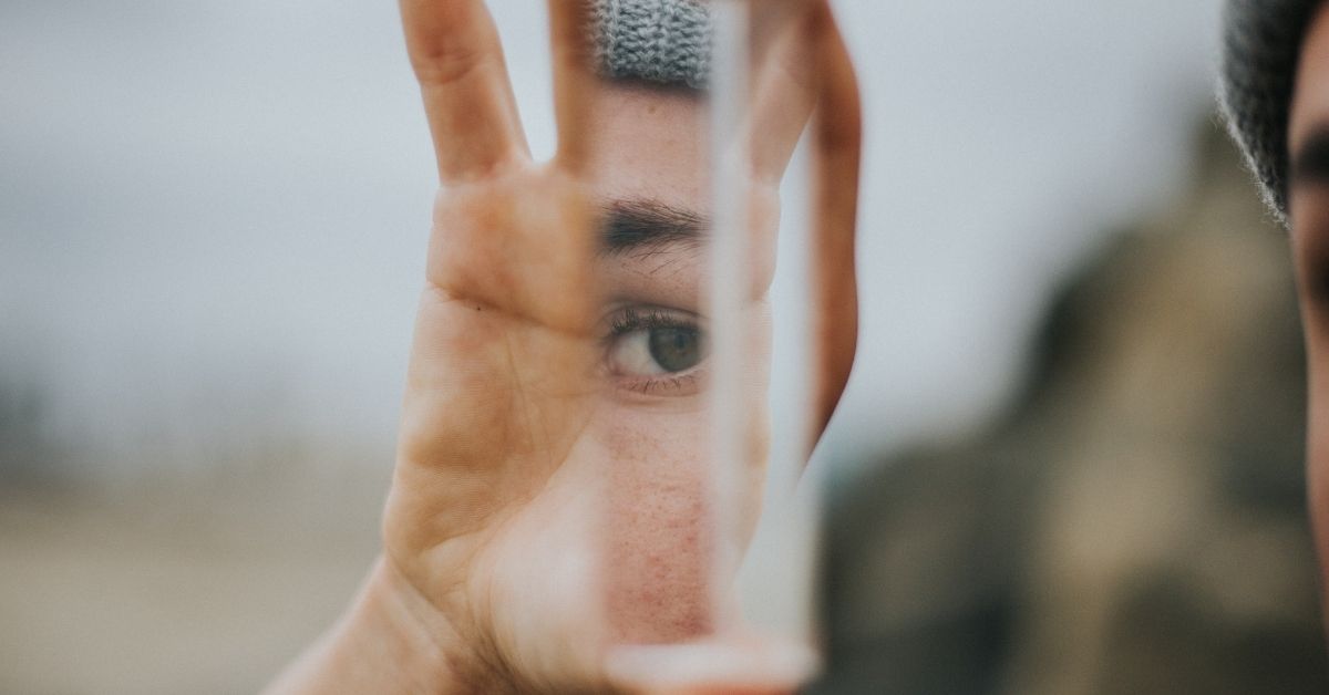 man holding a mirror