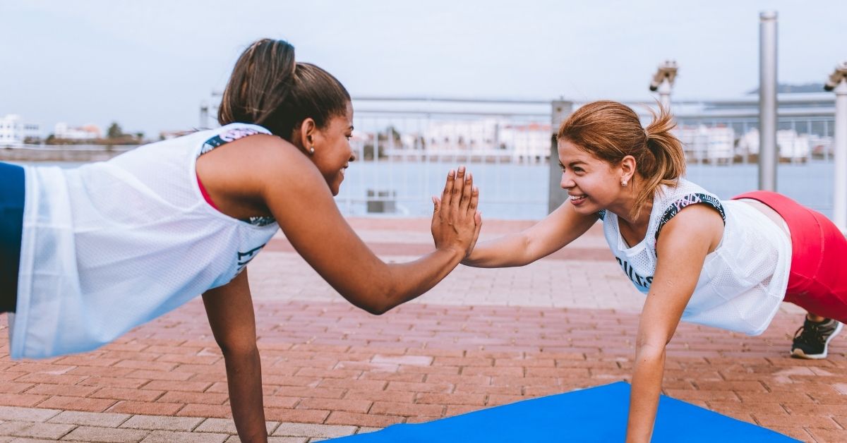 two girls working out together