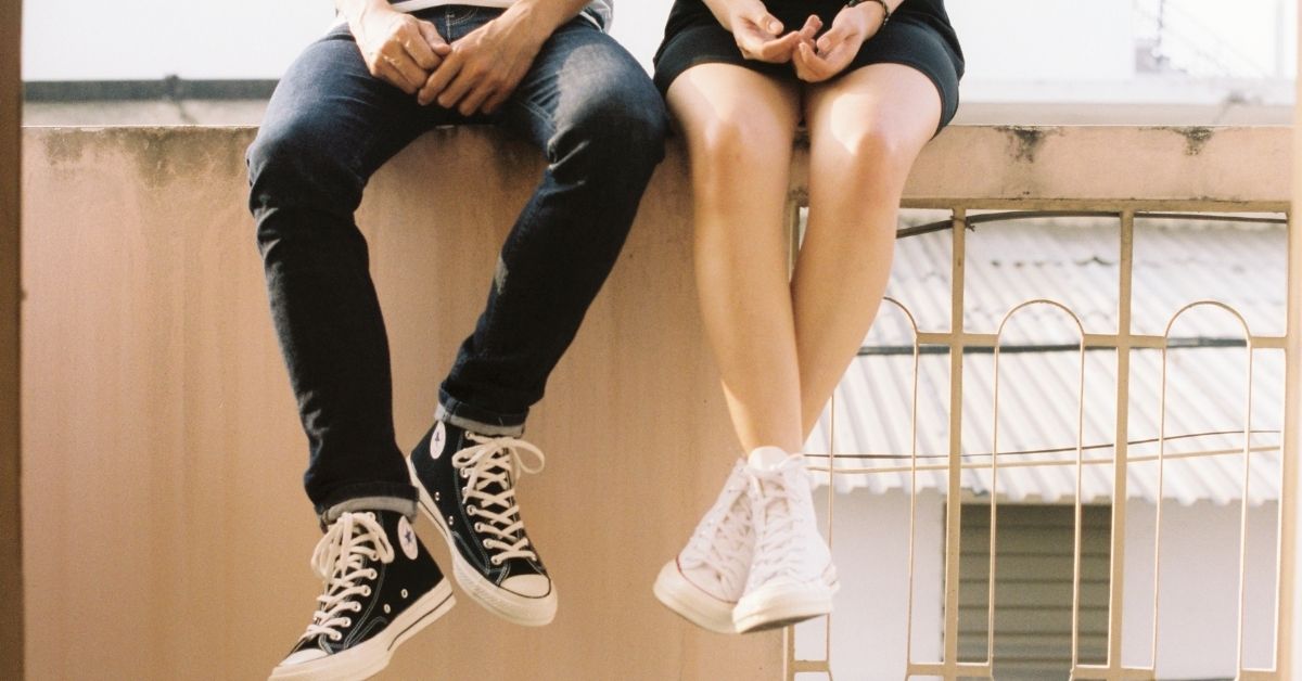 girl and boy teen sitting beside each other