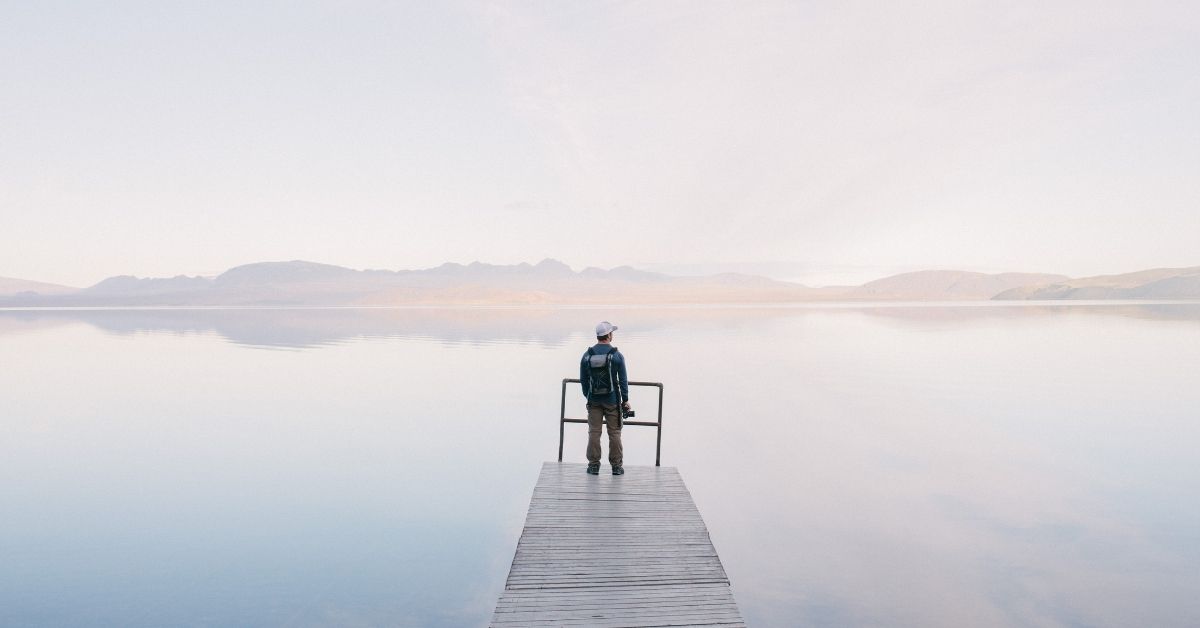 person waiting on a jetty