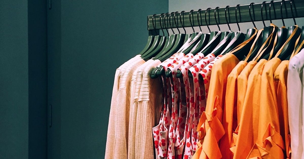 clothes rack with shirts and blouses