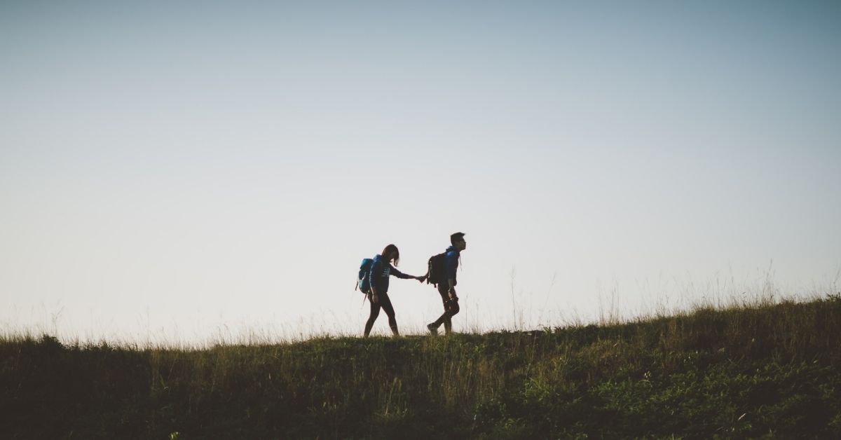 a person leads another by the hand