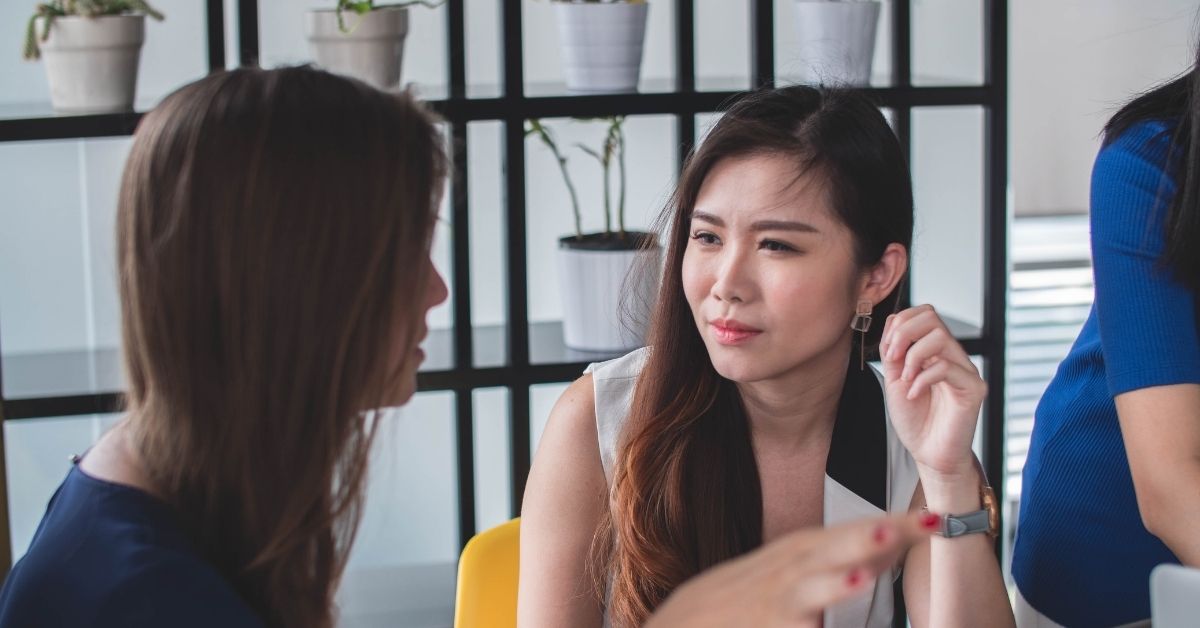 young women in a conversation