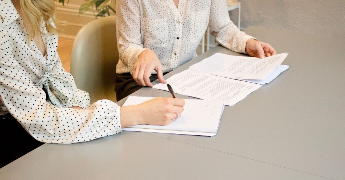 financial adviser working with a client