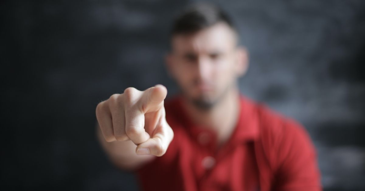 man pointing his finger in judgement