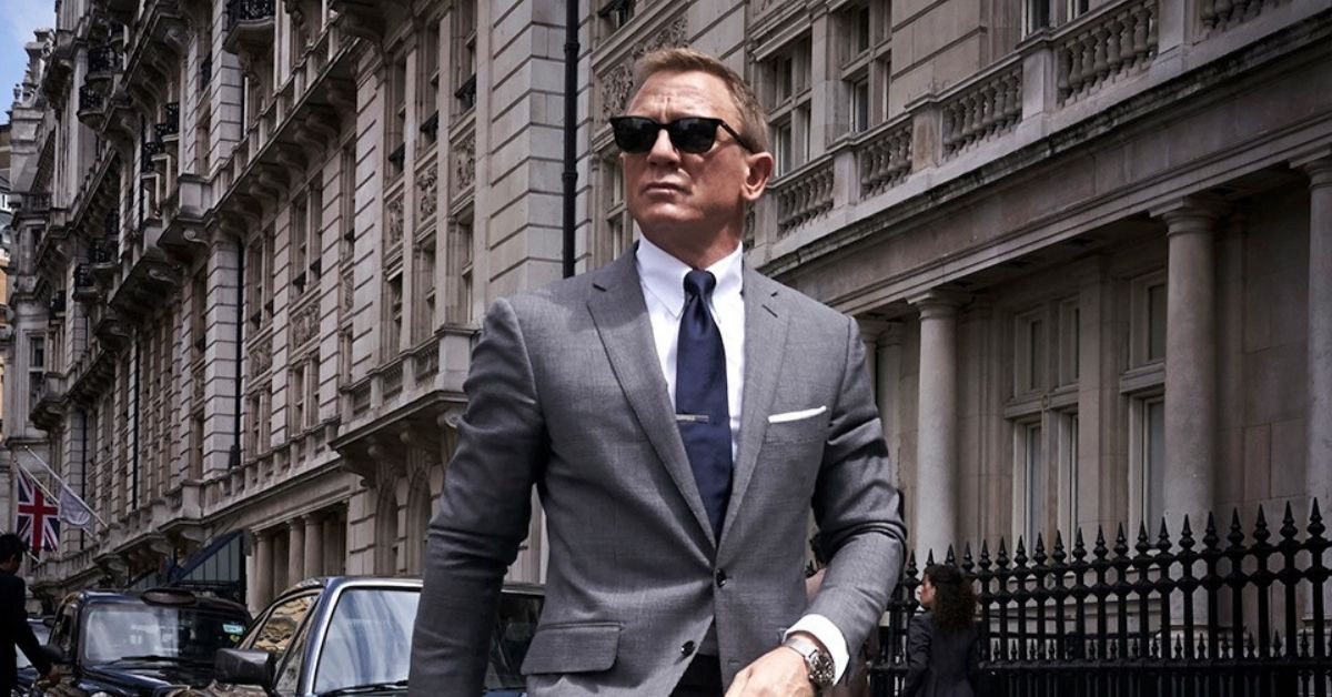 james bond walking down the street with sunglasses