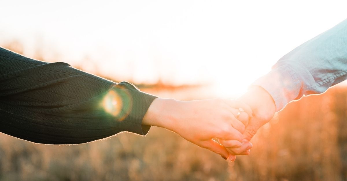 a couple holding hands