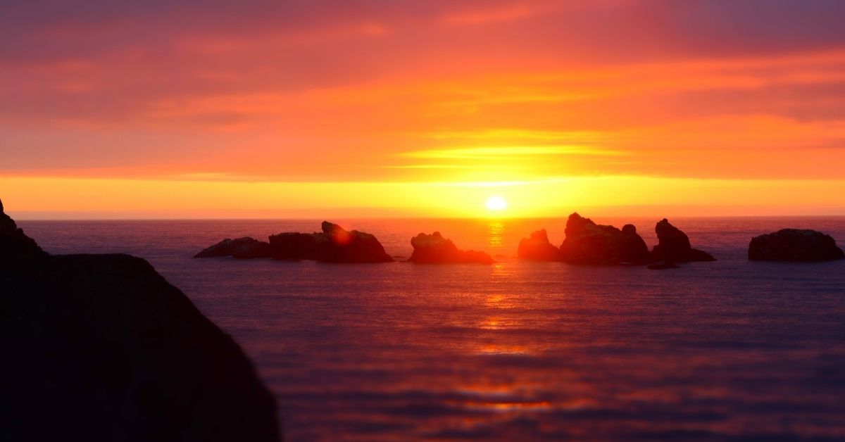 deep red sunrise over water