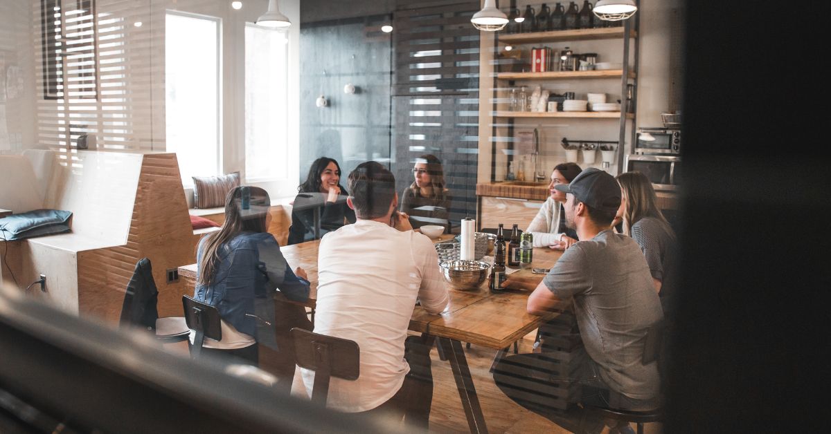 Meeting of workers in an office kitchen