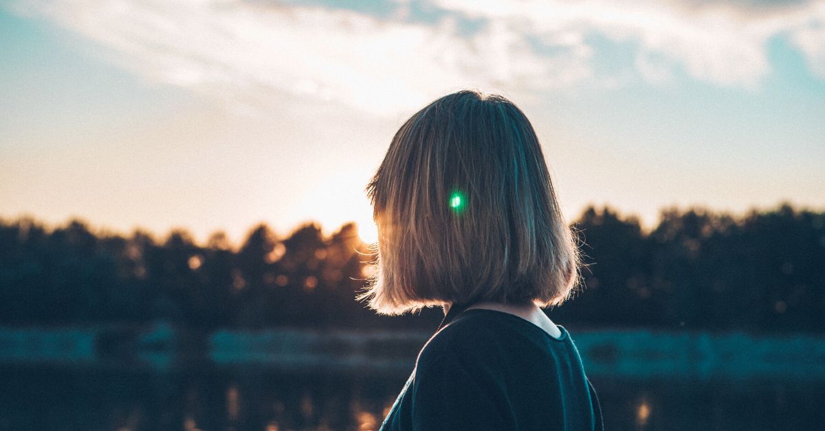 Woman thinking outdoors