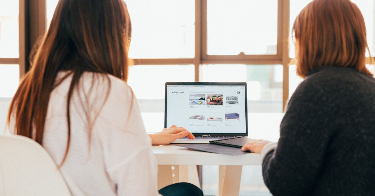 Workers at a laptop