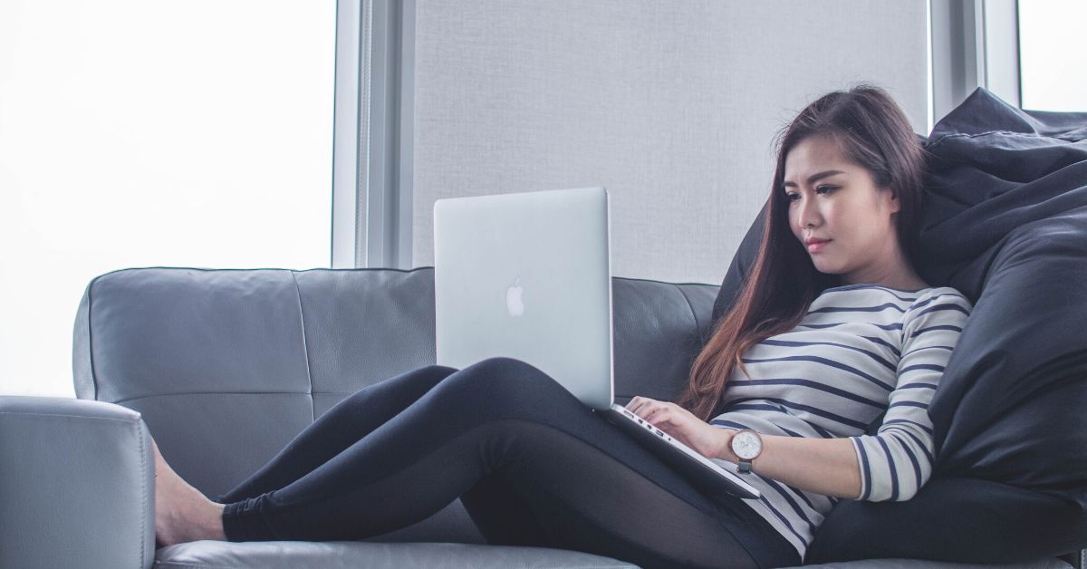 Young woman at home with laptop