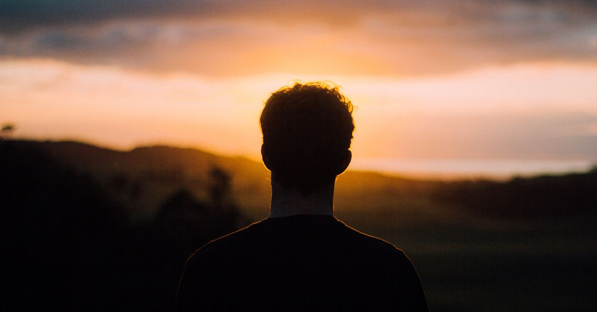 Man looking at Sunset